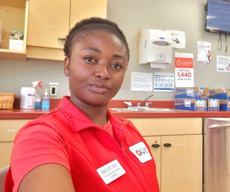 Canadian Blood Services volunteer in red shirt