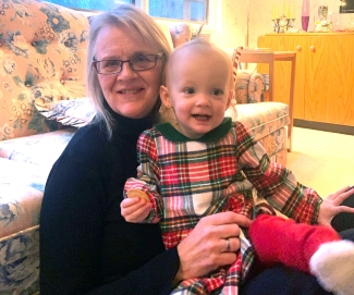 Stem cell recipient holding child in living room