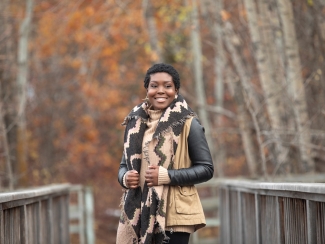 adult woman who received stem cell transplant for sickle cell disease with fall background