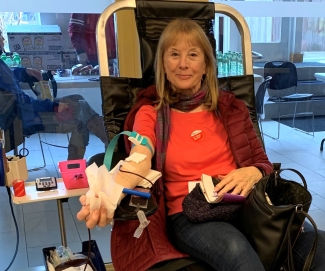 Woman donating blood at donor centre