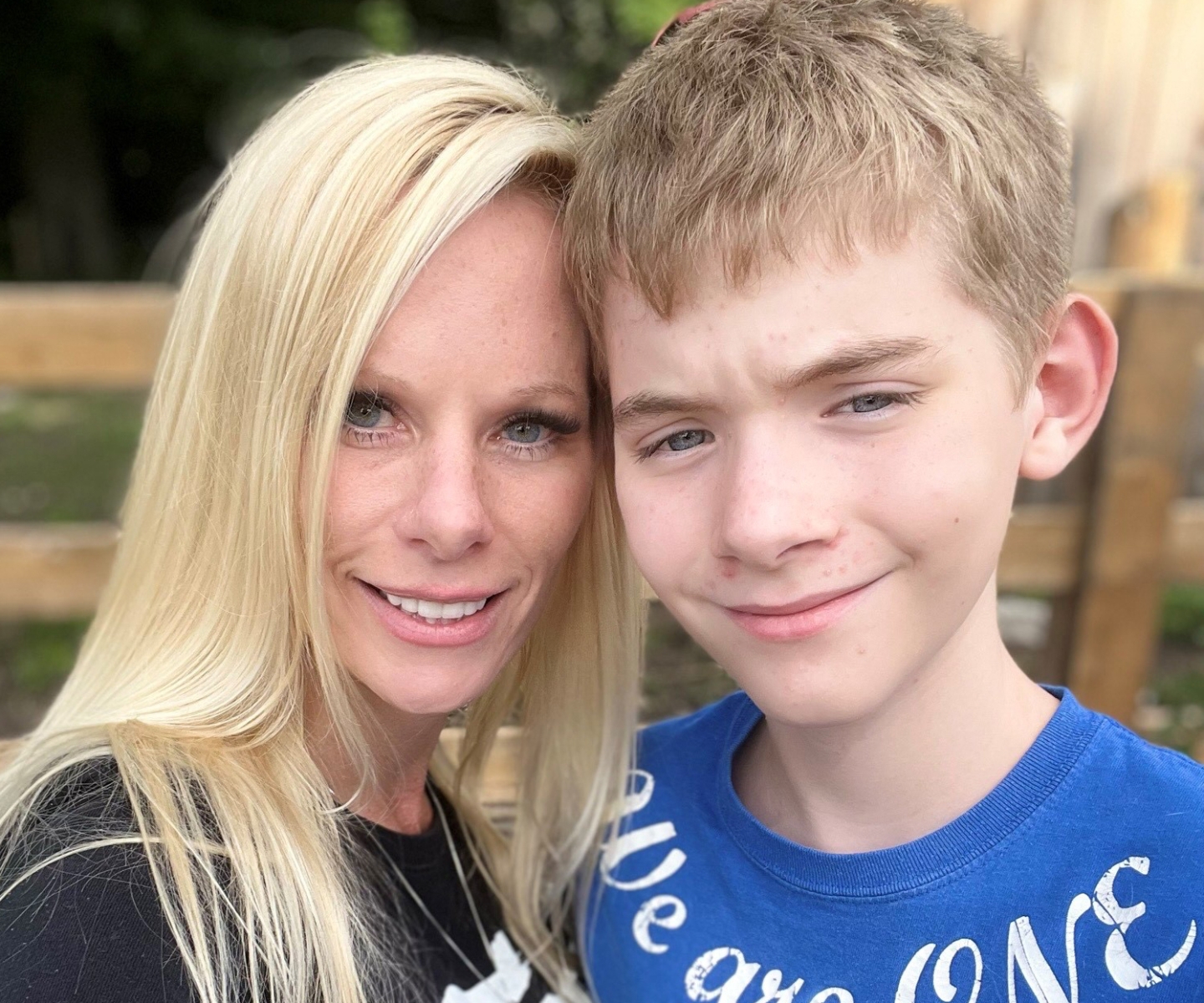 Carrie a plasma recipient next to her son