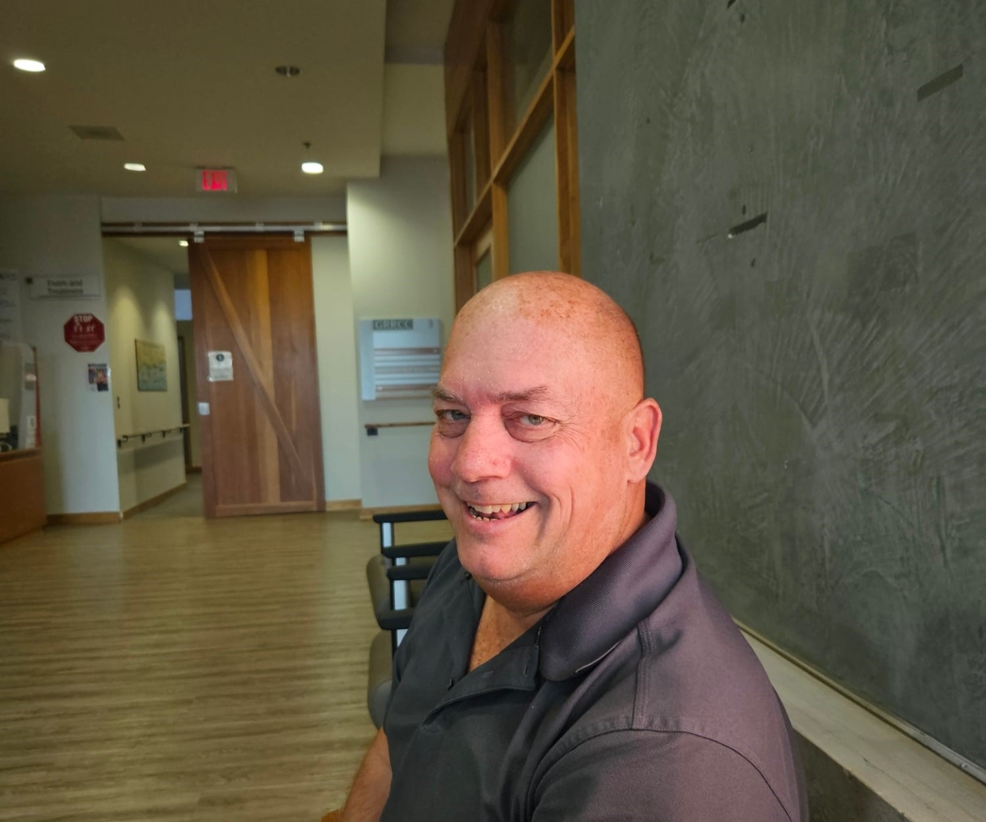 Stem cell recipient sitting and looking at camera