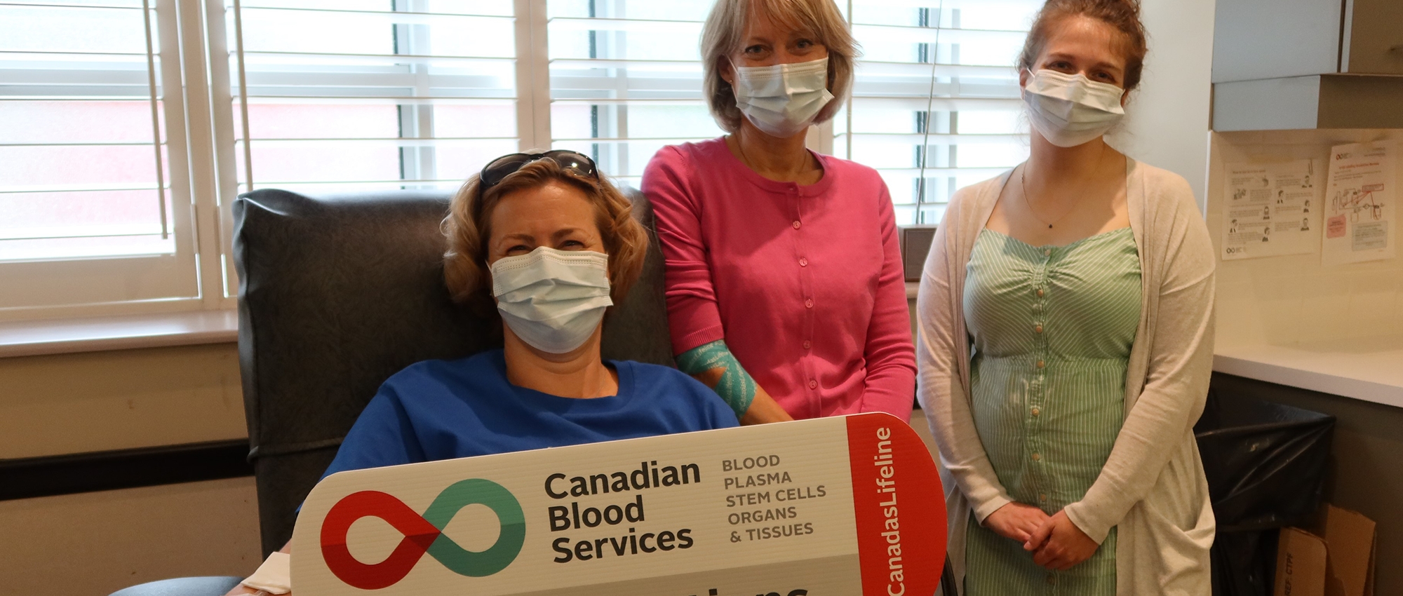 RBC Blood donor in donor chair with Canadian Blood Services staff   