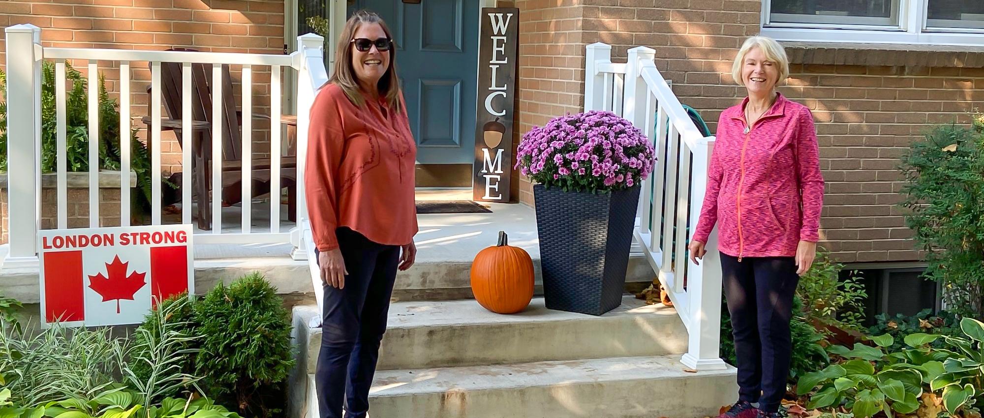 Featured image of Lissa Regan and Judy Howard standing outside of a home.