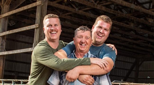 Blood and plasma recipient being hugged by his sons