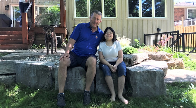 Stem cell donor and recipient sitting on a rock